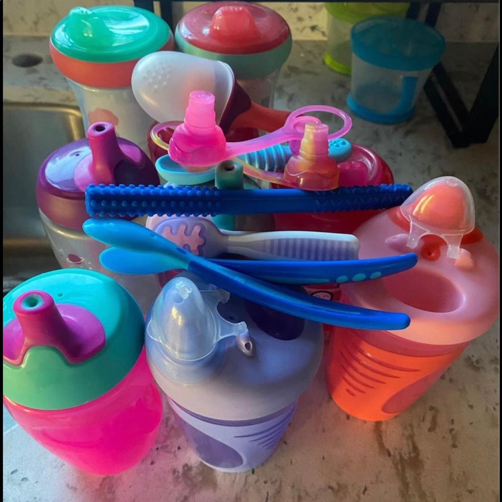 Bundle of sippy cups and training spoons